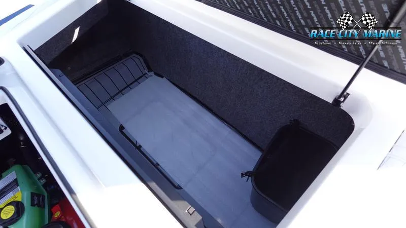Slide: The Image of 2025 Nautique Super Air Nautique G23 storage compartment, open with visible interior details. - 36