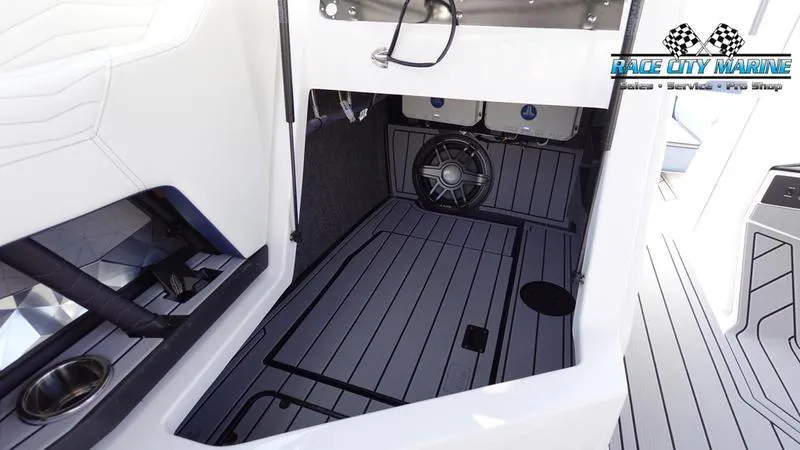 Slide: The Image of 2025 Nautique Super Air Nautique G23 interior storage compartment with speaker. - 41