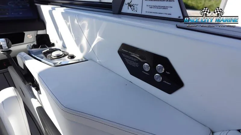 Slide: The Image of 2025 Nautique Super Air Nautique G23 interior dashboard with control panel and sleek design. - 49
