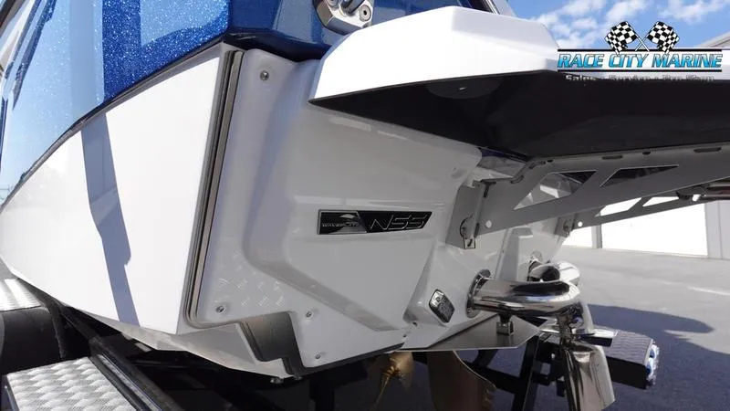 Slide: The Image of 2025 Nautique Super Air Nautique G23 boat rear view with Race City Marine logo. - 8