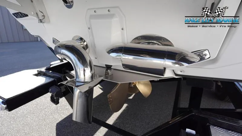 Slide: The Image of 2025 Nautique Super Air Nautique G23 boat exhaust and propeller detail. - 9