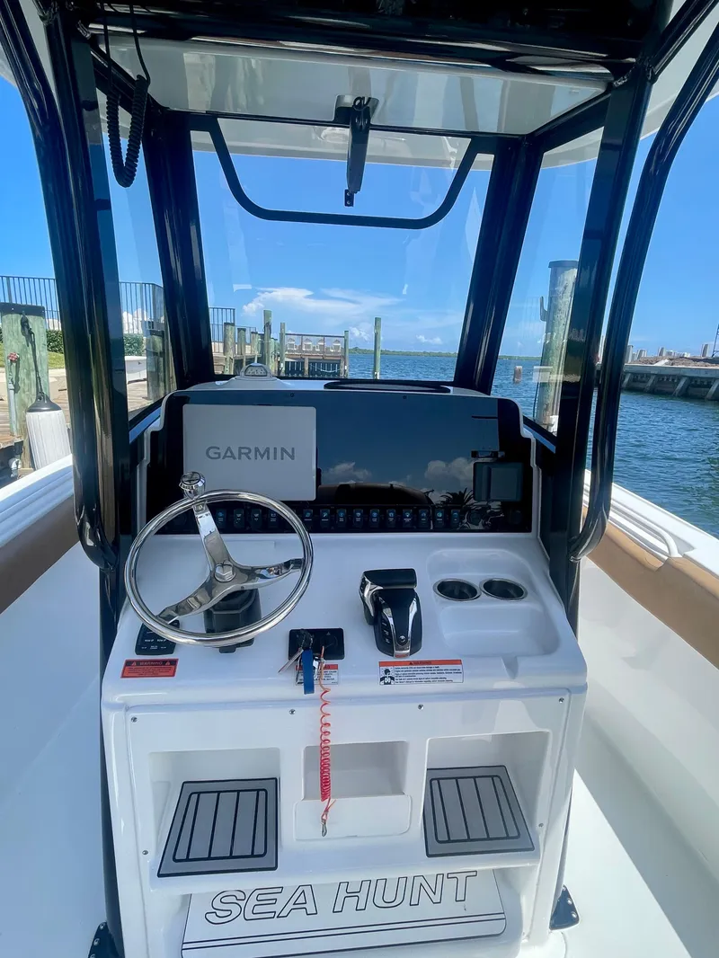 Slide: The Image of 2023 Sea Hunt Ultra 255 SE boat dashboard with Garmin navigation system. - 1