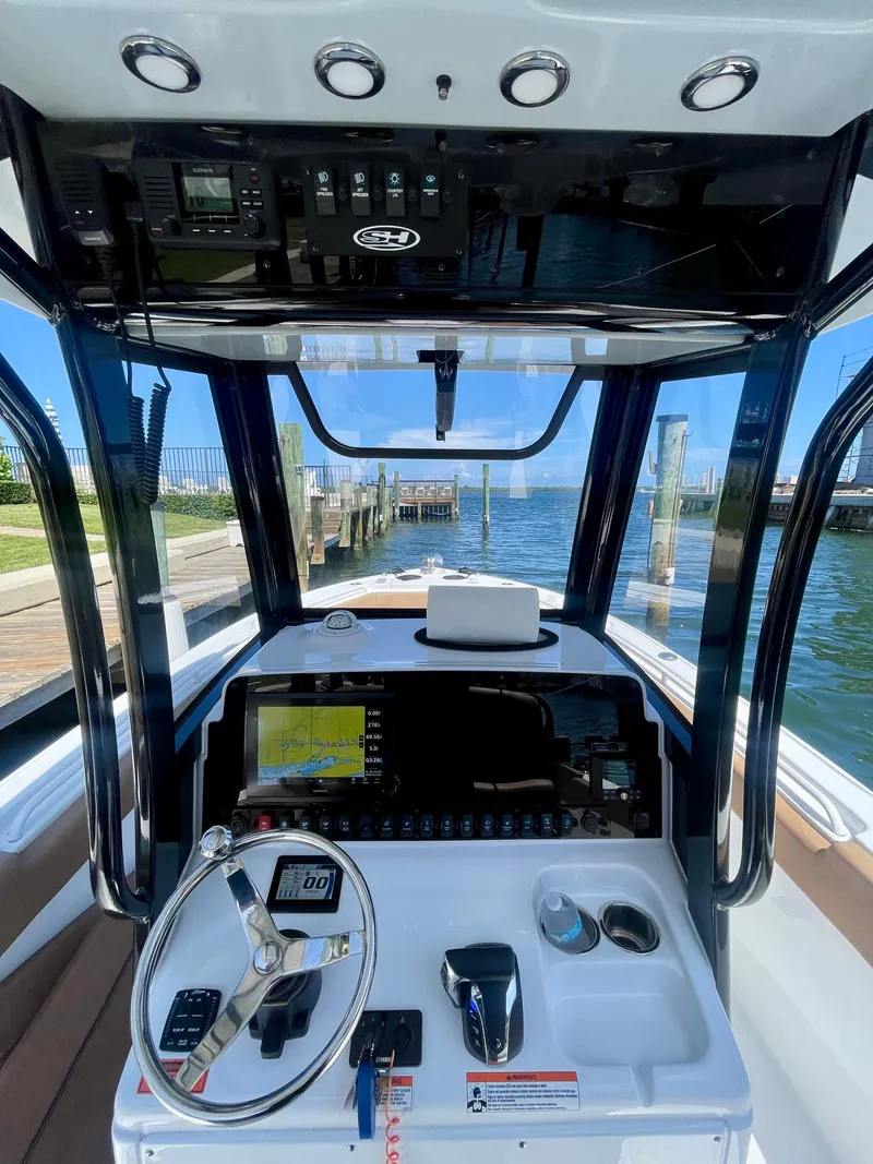 Slide: The Image of 2023 Sea Hunt Ultra 255 SE boat dashboard with advanced navigation controls. - 3