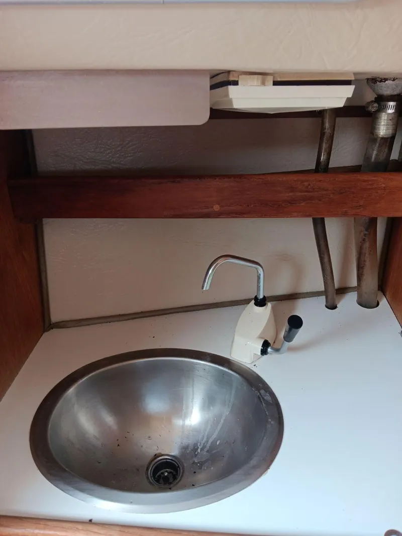 Slide: The Image of 1985 Catalina Fin Keel boat sink with stainless steel basin and faucet. - 7