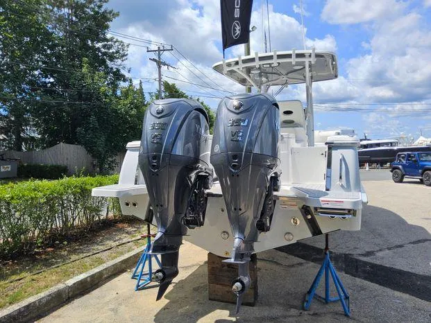 Slide: The Image of 2026 Southport 30FE boat with dual outboard engines in a warehouse setting. - 3