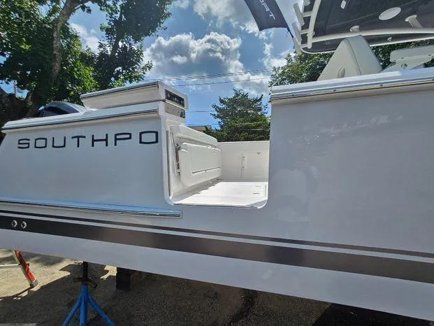 Slide: The Image of 2026 Southport 30FE boat with dual engines in a warehouse setting. - 4