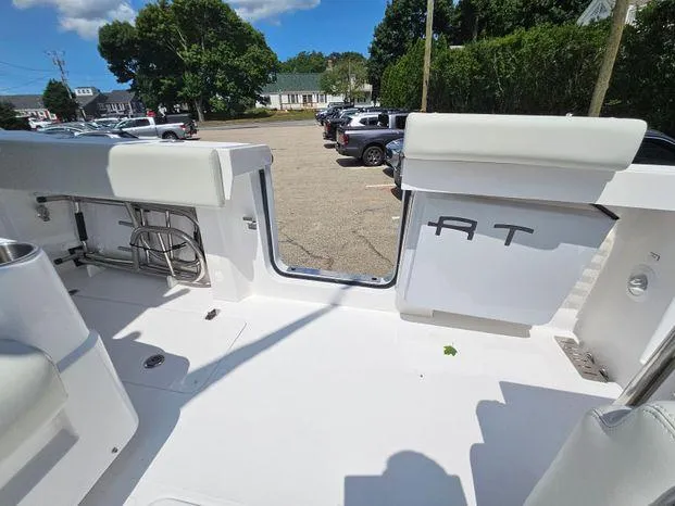 Slide: The Image of 2026 Southport 30FE boat interior with white seating and wooden accents in a workshop setting. - 9