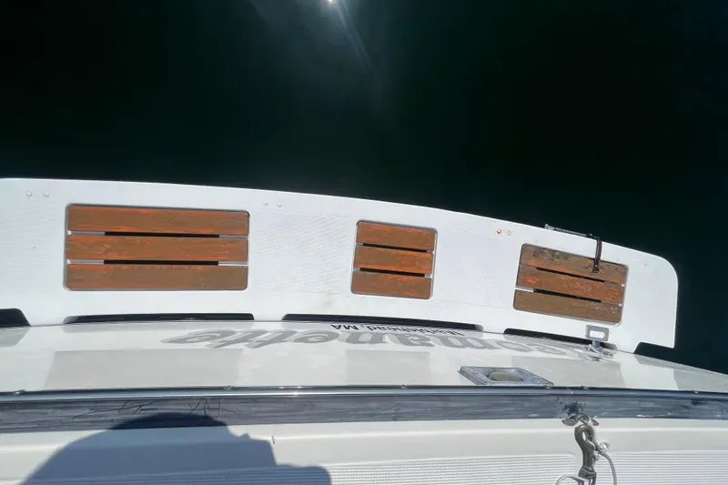 Slide: The Image of 1990 Tiara Yachts 3100 swim platform with wooden slats, viewed from above. - 5