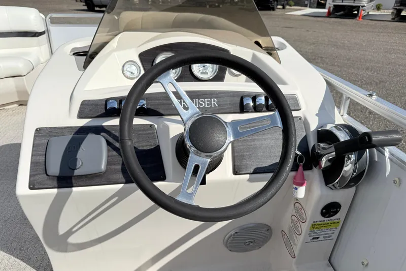 Slide: The Image of Steering console of a 2014 Harris FloteBote 20 pontoon boat with controls and gauges. - 15