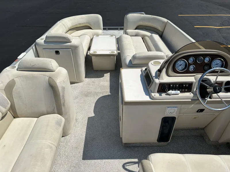 Slide: The Image of 2002 Crest Savannah boat interior with beige seating and control panel. - 15