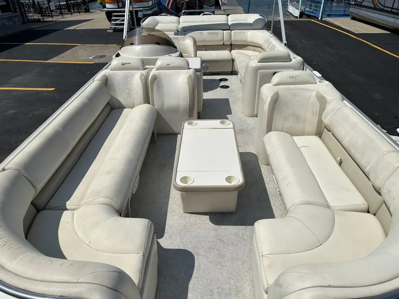 Slide: The Image of 2002 Crest Savannah pontoon boat with spacious seating and central table. - 7