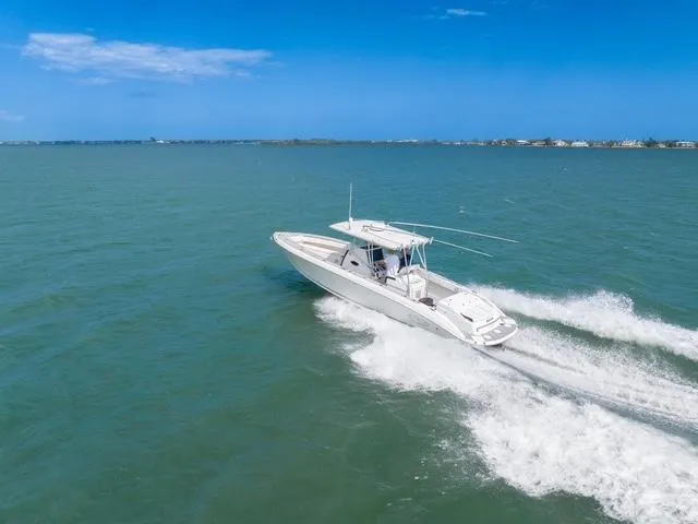 Slide: The Image of 2007 Spectre 37 Center Console boat cruising on open water. - 1