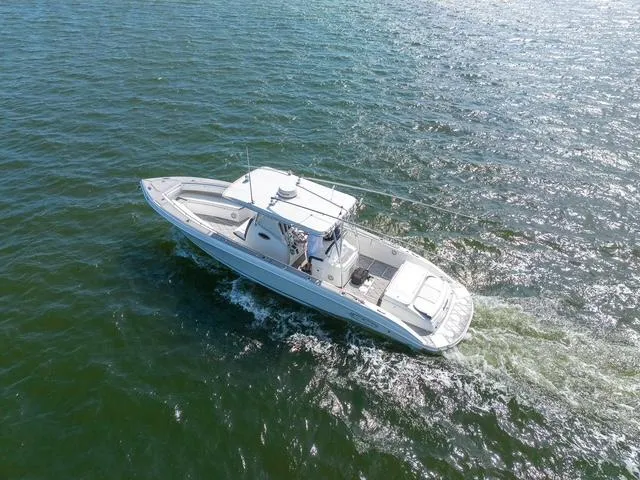 Slide: The Image of 2007 Spectre 37 Center Console boat cruising on open water. - 11