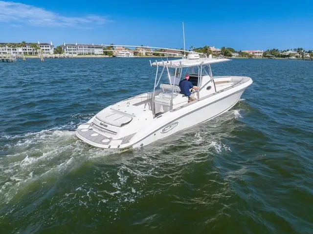Slide: The Image of 2007 Spectre 37 Center Console boat cruising on a sunny day in coastal waters. - 12