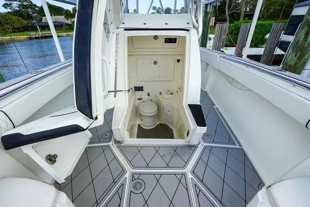 Slide: The Image of 2007 Spectre 37 Center Console boat interior with open cabin and toilet. - 15