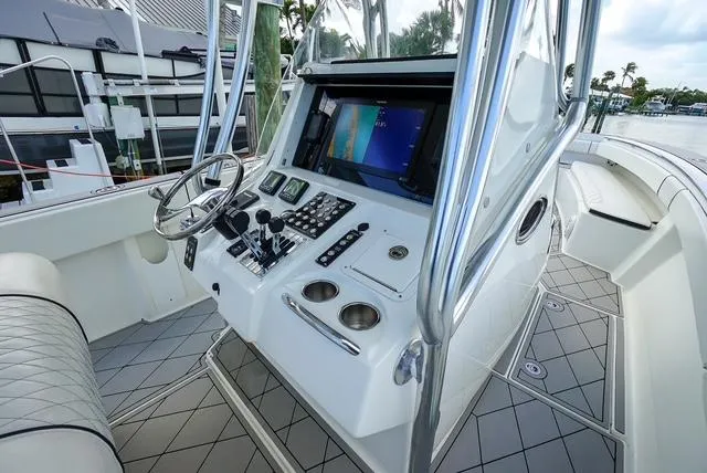 Slide: The Image of 2007 Spectre 37 Center Console boat interior with modern controls and navigation system. - 19