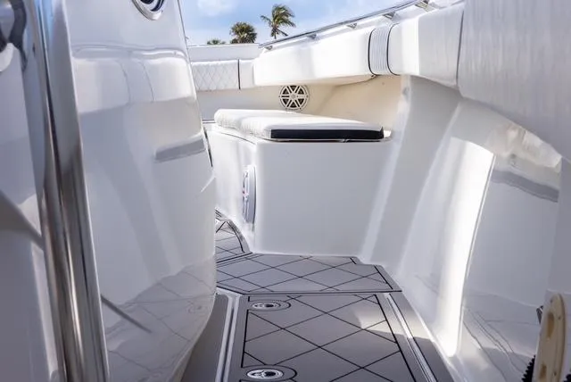 Slide: The Image of 2007 Spectre 37 Center Console boat interior with sleek white seating and modern design. - 29