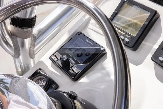 Slide: The Image of 2007 Spectre 37 Center Console dashboard with navigation instruments and steering wheel. - 31