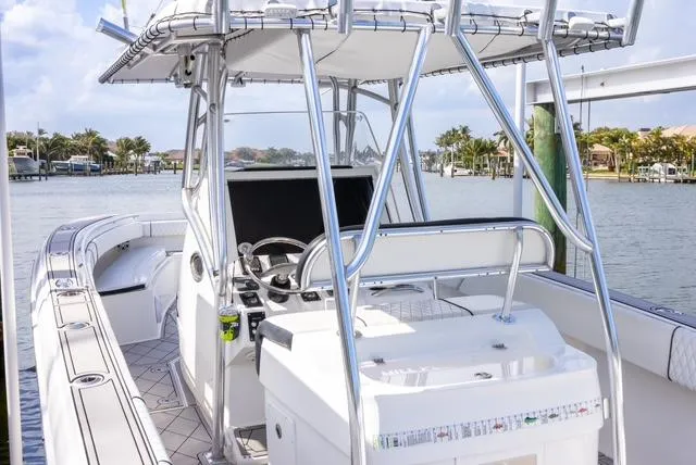 Slide: The Image of 2007 Spectre 37 Center Console boat with sleek design and spacious deck. - 33