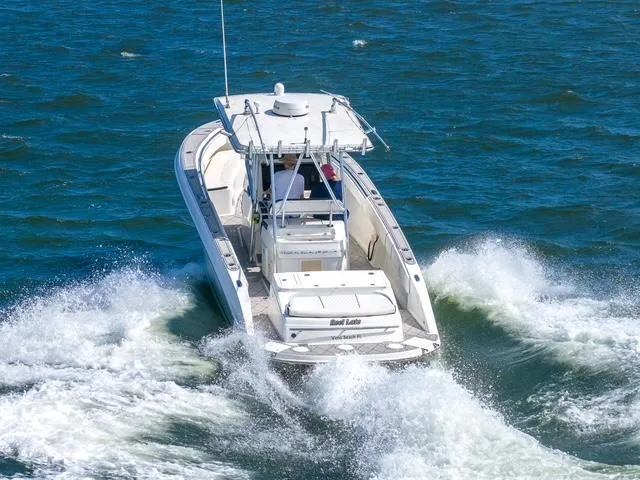 Slide: The Image of 2007 Spectre 37 Center Console boat navigating through ocean waves. - 8