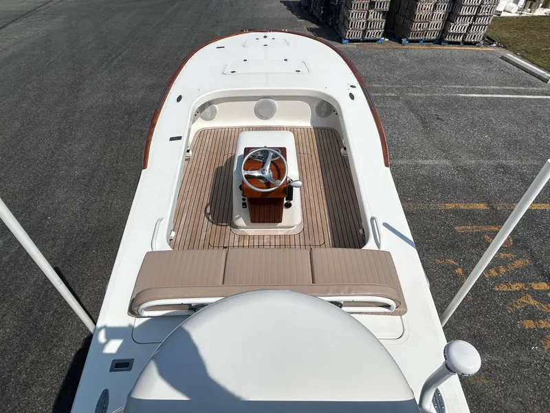 Slide: The Image of 2002 Bayshore Carolina Flats 20 boat with wooden deck and central steering console. - 10