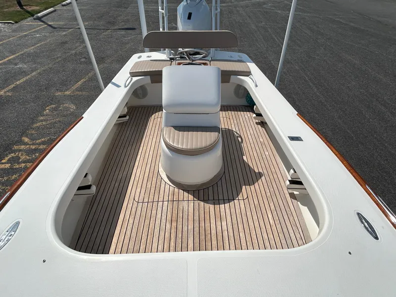 Slide: The Image of 2002 Bayshore Carolina Flats 20 boat with wooden deck and seating. - 12