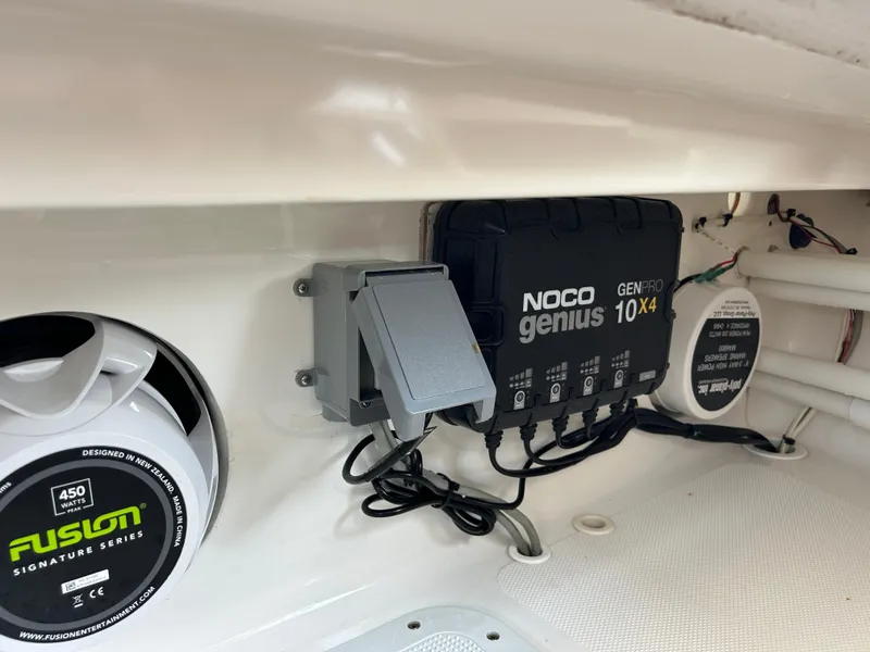 Slide: The Image of NOCO Genius charger and Fusion speaker in 2002 Bayshore Carolina Flats 20 boat. - 24