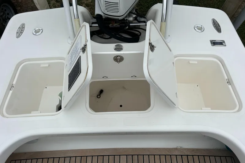 Slide: The Image of Open storage compartments on a 2002 Bayshore Carolina Flats 20 boat. - 26