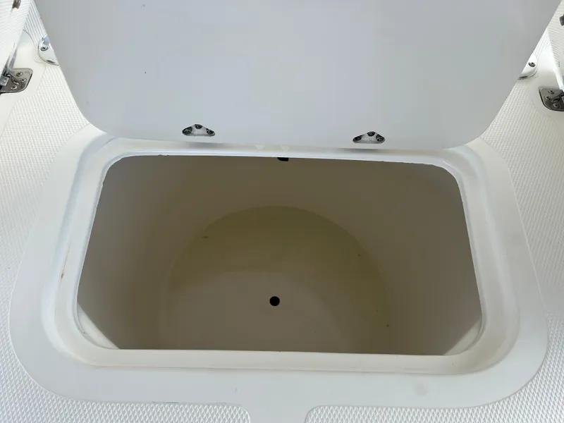 Slide: The Image of Open storage compartment on 2002 Bayshore Carolina Flats 20 boat. - 27