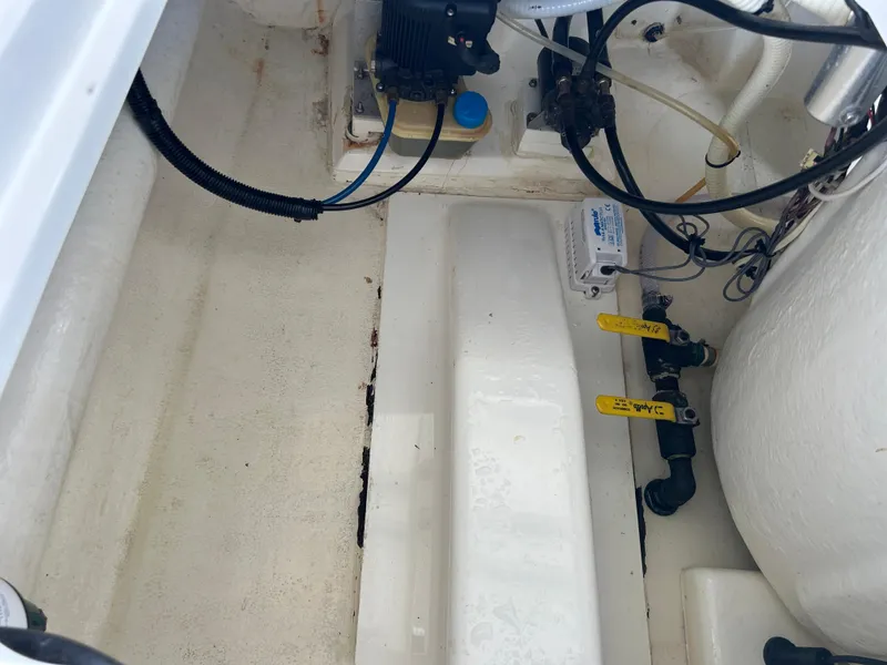 Slide: The Image of 2002 Bayshore Carolina Flats 20 boat interior with wiring and components. - 29