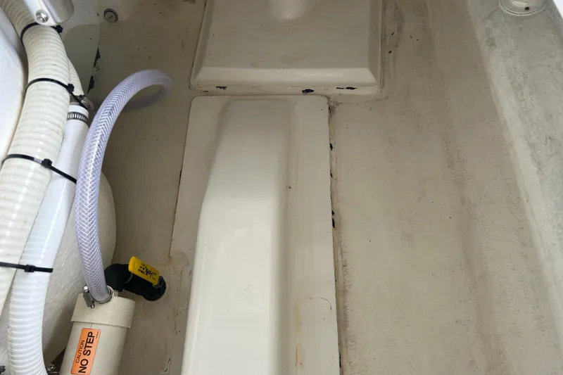 Slide: The Image of Interior of 2002 Bayshore Carolina Flats 20 boat showing bilge area and pump. - 30
