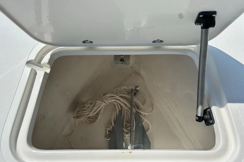 Slide: The Image of Anchor storage compartment on 2002 Bayshore Carolina Flats 20 boat. - 31