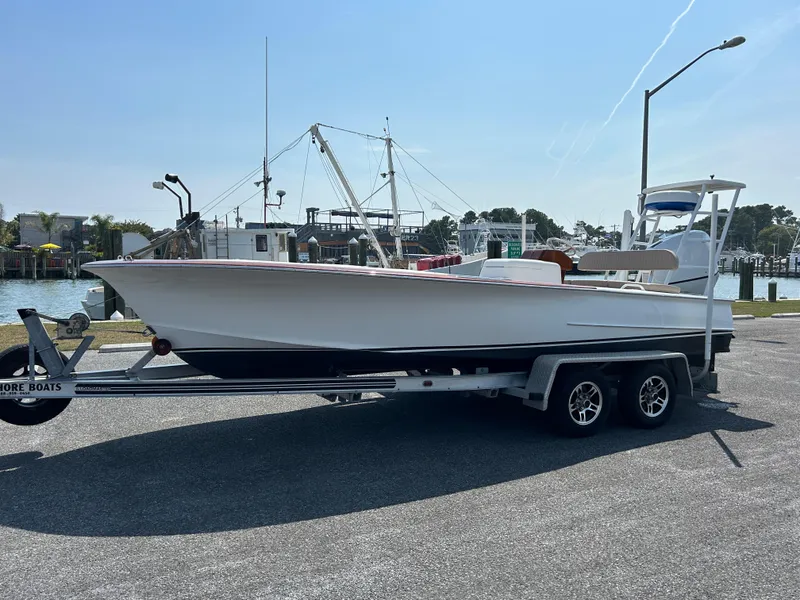 Slide: The Image of 2002 Bayshore Carolina Flats 20 boat on trailer at marina. - 6
