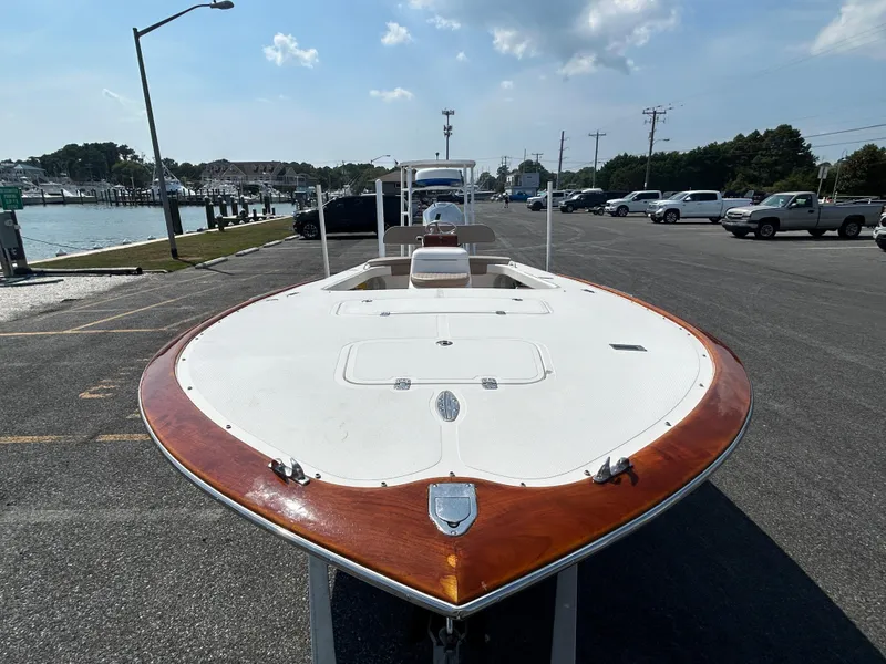 Slide: The Image of 2002 Bayshore Carolina Flats 20 boat parked near waterfront on sunny day. - 7
