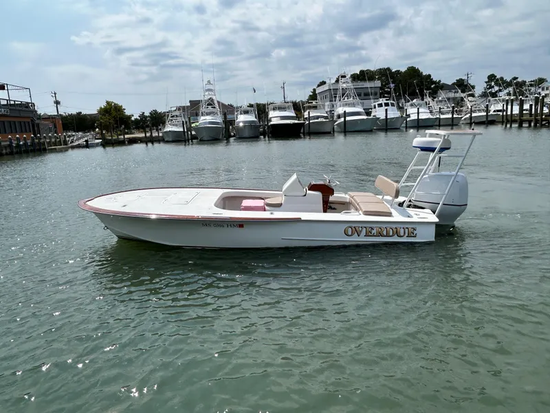 Slide: The Image of 2002 Bayshore Carolina Flats 20 boat on water near marina. - 9