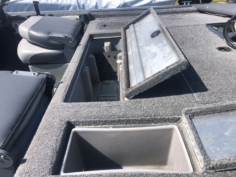 Slide: The Image of 2014 Tracker Pro Team 175 TF boat interior with open storage compartments. - 10