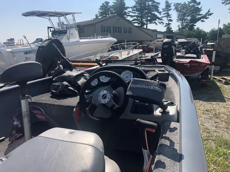 Slide: The Image of 2014 Tracker Pro Team 175 TF boat interior with steering wheel and gauges. - 3