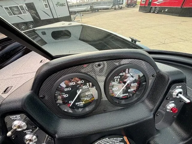 Slide: The Image of Dashboard of 2025 Crestliner 1650 Kodiak boat with speedometer and tachometer. - 12