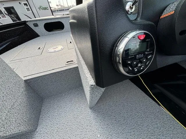 Slide: The Image of 2025 Crestliner 1650 Kodiak boat interior with dashboard and control panel. - 13