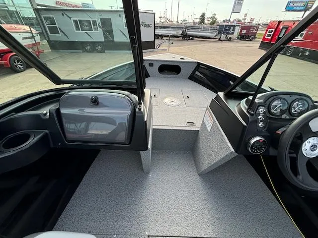 Slide: The Image of 2025 Crestliner 1650 Kodiak boat interior with steering wheel and dashboard. - 14