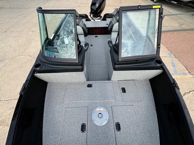 Slide: The Image of 2025 Crestliner 1650 Kodiak boat interior with open windshield and seating. - 20