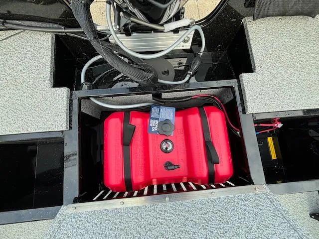 Slide: The Image of 2025 Crestliner 1650 Kodiak boat interior with red fuel tank and wiring. - 27