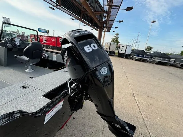 Slide: The Image of 2025 Crestliner 1650 Kodiak boat with Mercury 60 outboard motor in a dealership lot. - 4