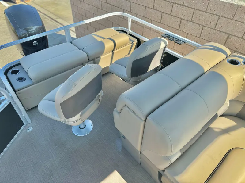 Slide: The Image of 2023 Sun Tracker Sport Fish 22 DLX pontoon boat interior with beige seating. - 16