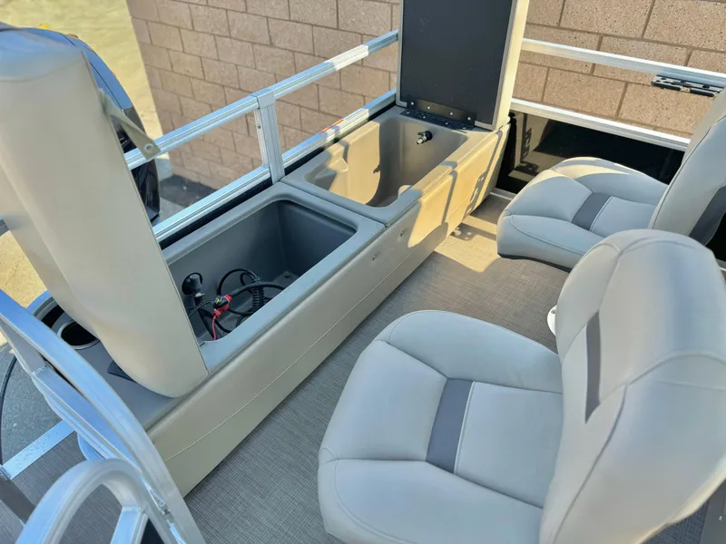 Slide: The Image of 2023 Sun Tracker Sport Fish 22 DLX interior seating and storage compartments. - 17