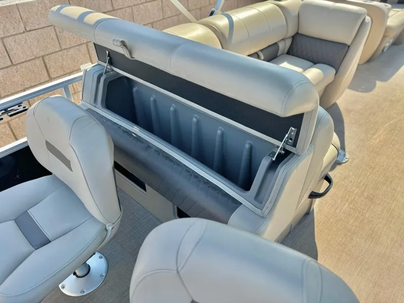 Slide: The Image of 2023 Sun Tracker Sport Fish 22 DLX boat interior with open storage compartment. - 19