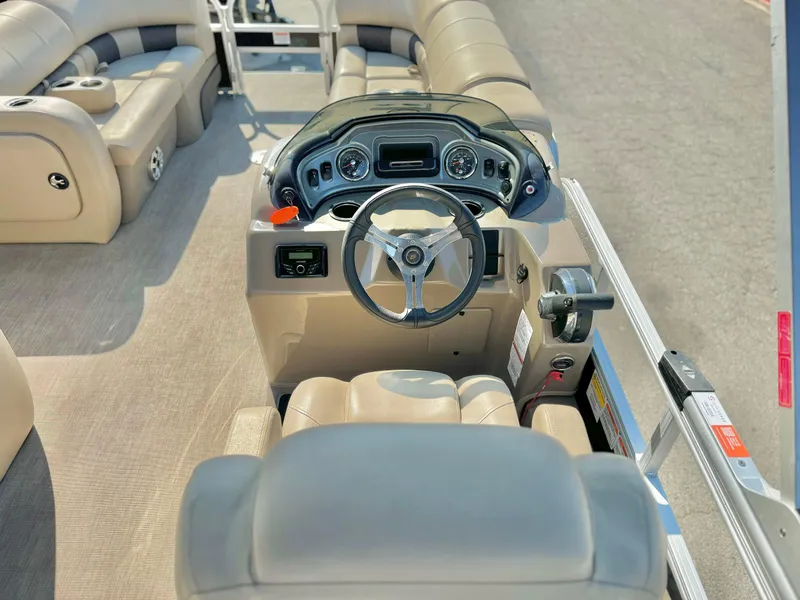 Slide: The Image of 2023 Sun Tracker Sport Fish 22 DLX boat interior with steering console and seating. - 21