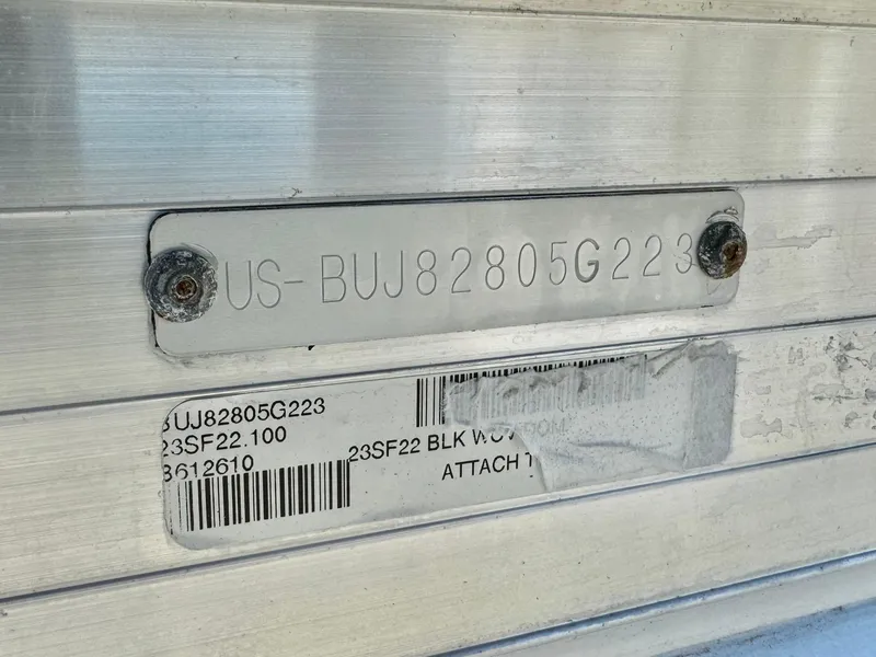 Slide: The Image of 2023 Sun Tracker Sport Fish 22 DLX identification plate with serial number. - 24