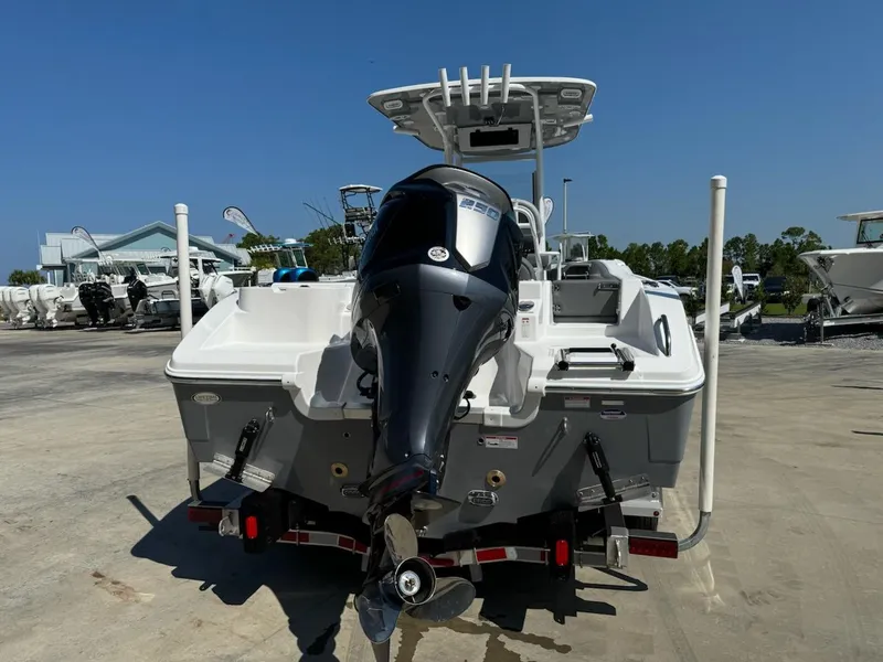 Slide: The Image of 2025 NauticStar 242L Offshore boat with powerful outboard motor, parked on a trailer. - 4