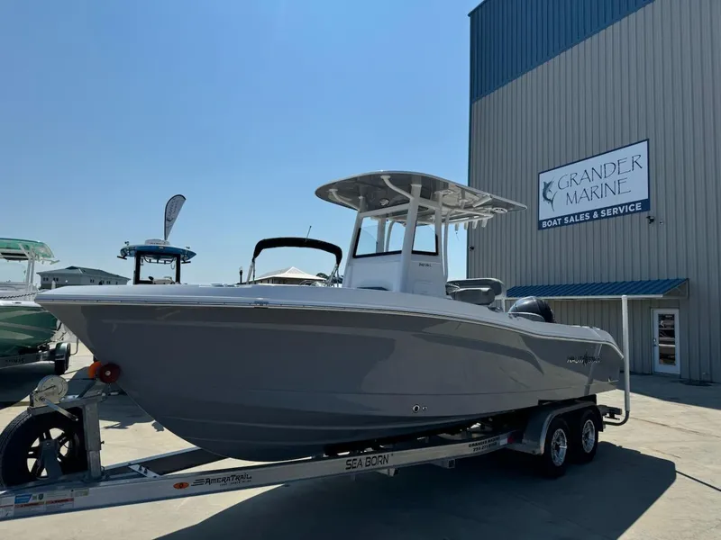 Slide: The Image of 2025 NauticStar 242L Offshore boat on trailer at Grander Marine dealership. - 5